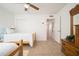 Comfortable bedroom with twin beds, adjacent to closet and hallway, offering convenience and accessibility at 13055 W Tangelo Dr, Sun City West, AZ 85375