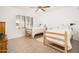 Bright bedroom with two twin beds, plantation shutters and tile floors, perfect for guests or Gathering at 13055 W Tangelo Dr, Sun City West, AZ 85375