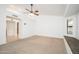 Bright bedroom features a ceiling fan, walk-in shower, and cozy window seat at 13055 W Tangelo Dr, Sun City West, AZ 85375