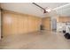 Spacious garage with ample storage cabinets, overhead lighting, and utility sink at 13055 W Tangelo Dr, Sun City West, AZ 85375