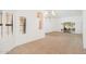 Spacious living area with tile flooring, shuttered windows, and access to a carpeted area at 13055 W Tangelo Dr, Sun City West, AZ 85375