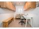 Bright office featuring built-in cabinets, a desk, and a comfortable seating area at 13055 W Tangelo Dr, Sun City West, AZ 85375