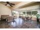 Relaxing sunroom with comfortable seating and views of the lush backyard creating a serene retreat at 13055 W Tangelo Dr, Sun City West, AZ 85375