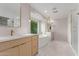 Bright bathroom with double sinks, soaking tub, and walk-in shower at 13367 W Jesse Red Dr, Peoria, AZ 85383
