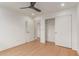 Bedroom with hardwood floors and walk-in closet at 13367 W Jesse Red Dr, Peoria, AZ 85383
