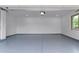 Spacious garage with epoxy flooring, providing a clean and durable surface at 13367 W Jesse Red Dr, Peoria, AZ 85383