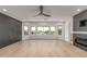 Sunlit living room with a modern fireplace and large windows that offers natural light and views at 13367 W Jesse Red Dr, Peoria, AZ 85383