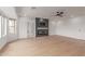 Bright living room with fireplace, and hardwood floors at 13367 W Jesse Red Dr, Peoria, AZ 85383