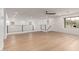 Large loft space with neutral walls, light flooring, recessed lighting, and a modern railing system at 13367 W Jesse Red Dr, Peoria, AZ 85383