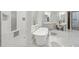 This bright bathroom offers a freestanding tub, shower, and dual vanity at 13750 E Yucca St, Scottsdale, AZ 85259