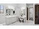 Bright primary bathroom featuring double vanity, granite countertops, and an attached makeup area at 13750 E Yucca St, Scottsdale, AZ 85259