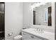 Bright bathroom features tiled shower, white vanity with marble countertop, and modern fixtures at 13750 E Yucca St, Scottsdale, AZ 85259