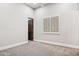 Bedroom featuring neutral carpet, white trim, window with shutters, and ceiling fan at 13750 E Yucca St, Scottsdale, AZ 85259