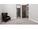 Bedroom featuring a walk-in closet, hardwood door, and neutral paint scheme at 13750 E Yucca St, Scottsdale, AZ 85259
