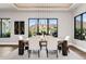 Bright dining room with mountain views, a modern chandelier, and a wood table with seating for six at 13750 E Yucca St, Scottsdale, AZ 85259