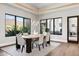 Bright dining room with a view of the mountains, stylish light fixture and area rug at 13750 E Yucca St, Scottsdale, AZ 85259