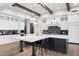 Spacious kitchen island with a breakfast bar, stainless steel appliances, and custom cabinetry at 13750 E Yucca St, Scottsdale, AZ 85259