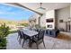 Outdoor living space with fireplace, lounge area, dining table, pool and mountain views at 13750 E Yucca St, Scottsdale, AZ 85259