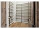 A pantry with wooden floors and lots of shelving for storage at 13750 E Yucca St, Scottsdale, AZ 85259