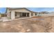 Spacious backyard with dirt and gravel awaiting your personal design at 13850 W Weaver Ct, Litchfield Park, AZ 85340