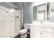 This bathroom showcases a shower with glass doors and a vanity with modern features at 13850 W Weaver Ct, Litchfield Park, AZ 85340
