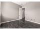 This neutral room offers tile floors, access to other rooms, and natural light at 13850 W Weaver Ct, Litchfield Park, AZ 85340