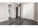 This bedroom has a sliding door closet and a view to an en-suite bathroom at 13850 W Weaver Ct, Litchfield Park, AZ 85340
