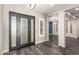 Inviting entryway with a modern front door and tile flooring leading to the living spaces at 13850 W Weaver Ct, Litchfield Park, AZ 85340