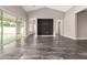 Bright, open living space with tile floors and sliding glass doors leading to the outdoors at 13850 W Weaver Ct, Litchfield Park, AZ 85340