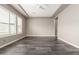 This neutral living room offers tile floors, recessed lights and white window shutters for a light, airy feel at 13850 W Weaver Ct, Litchfield Park, AZ 85340