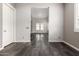 Open living room showcasing tile floors and a bright and airy atmosphere at 13850 W Weaver Ct, Litchfield Park, AZ 85340