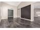 Open living space featuring tile flooring, neutral walls, and ample natural light at 13850 W Weaver Ct, Litchfield Park, AZ 85340