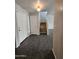 Inviting entryway with tile flooring, staircase, and ample natural light at 13921 W Port Royale Ln, Surprise, AZ 85379