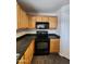 Modern kitchen with stainless steel appliances, wooden cabinetry, and durable countertops at 13921 W Port Royale Ln, Surprise, AZ 85379