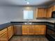 Bright kitchen featuring wood cabinets, stainless steel appliances, and ample counter space at 13921 W Port Royale Ln, Surprise, AZ 85379