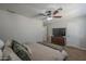 Bedroom features a ceiling fan and an entertainment center, with ensuite access at 1461 W Tara Dr, Gilbert, AZ 85233