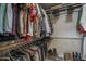 Walk-in closet with ample hanging space, shelving, and shoe storage, offering organized storage at 1461 W Tara Dr, Gilbert, AZ 85233
