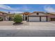 Charming single-story home featuring a three-car garage and desert landscaping at 1461 W Tara Dr, Gilbert, AZ 85233