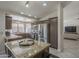 A kitchen with stainless steel appliances, granite countertops, a center island and ample cabinet space at 1461 W Tara Dr, Gilbert, AZ 85233