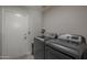 Efficient laundry room with modern washer and dryer set, offering convenience and functionality at 1461 W Tara Dr, Gilbert, AZ 85233
