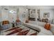 Bright living room boasts tile floors, vaulted ceiling, and a modern chandelier at 1461 W Tara Dr, Gilbert, AZ 85233