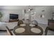 Inviting living area with a round dining table and a view into the entry way at 1461 W Tara Dr, Gilbert, AZ 85233