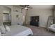 Large main bedroom with high ceilings, ceiling fan, ensuite bathroom and ample space at 1461 W Tara Dr, Gilbert, AZ 85233