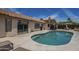Backyard view of the pool, covered patio, and lush landscaping at 1461 W Tara Dr, Gilbert, AZ 85233