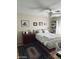 Bright bedroom with natural light, a comfortable bed, and wood floors at 14617 S 35Th Pl, Phoenix, AZ 85044