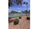 Community pickleball courts in a fenced-in area with bushes and shaded area at 14617 S 35Th Pl, Phoenix, AZ 85044