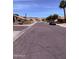 Peaceful street view with desert landscaping, homes, and mountain views at 14617 S 35Th Pl, Phoenix, AZ 85044