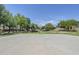 Community basketball court surrounded by lush greenery, perfect for outdoor activities and recreation at 14881 W Ashland Ave, Goodyear, AZ 85395
