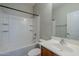 Neat bathroom with combined tub and shower, along with a single sink vanity at 14881 W Ashland Ave, Goodyear, AZ 85395