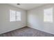 This is a simple bedroom with two windows providing plenty of natural light at 14881 W Ashland Ave, Goodyear, AZ 85395